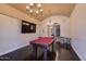 Entertaining game room with pool table, large TV, and stylish lighting at 1367 S Country Club S Dr # 1125, Mesa, AZ 85210