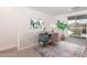 Comfortable landing area with desk and art, leading to sliding glass doors to patio at 1367 S Country Club S Dr # 1125, Mesa, AZ 85210