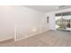 Spacious landing area with sliding glass doors to patio and carpeted floors at 1367 S Country Club S Dr # 1125, Mesa, AZ 85210