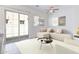 Inviting living space boasts a neutral sectional and a sliding glass door for bright, natural light at 1367 S Country Club S Dr # 1125, Mesa, AZ 85210
