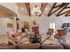 Inviting lobby with high ceilings, stone fireplace, chandelier, and comfortable seating at 1367 S Country Club S Dr # 1125, Mesa, AZ 85210