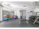 A community gym featuring weight training equipment, free weights, and mirrors at 15095 N Thompson Peak Pkwy # 3032, Scottsdale, AZ 85260