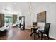 Bright, open-concept living area features modern lighting and a dining space with a glass table and chairs at 15095 N Thompson Peak Pkwy # 3032, Scottsdale, AZ 85260
