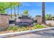 The community monument sign is surrounded by flowers at 15095 N Thompson Peak Pkwy # 3032, Scottsdale, AZ 85260