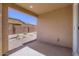 The back patio features a concrete floor and a textured stucco wall at 15600 W Williams St, Goodyear, AZ 85338
