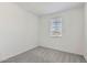 This bedroom features a window and neutral carpeting at 15600 W Williams St, Goodyear, AZ 85338