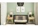 Stylish Bedroom with a modern crib, decorative lamps, and playful wall art at 15600 W Williams St, Goodyear, AZ 85338