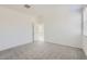 Carpeted bedroom featuring a bright neutral paint scheme and great natural light at 15600 W Williams St, Goodyear, AZ 85338