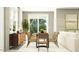 Bright dining area featuring modern furniture, a glass table, and a stylish sideboard at 15600 W Williams St, Goodyear, AZ 85338
