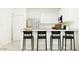 Bright kitchen featuring stainless steel appliances and a sleek breakfast bar at 15600 W Williams St, Goodyear, AZ 85338