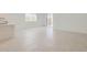Bright living room featuring tile flooring, modern windows, and access to a patio at 15600 W Williams St, Goodyear, AZ 85338