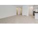 View of a living room with tile flooring, and a neutral paint scheme at 15600 W Williams St, Goodyear, AZ 85338