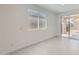 Bright living room with sliding glass doors and neutral walls at 15600 W Williams St, Goodyear, AZ 85338