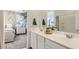 Clean bathroom featuring a dual sink vanity with granite countertop at 15627 W Williams St, Goodyear, AZ 85338