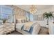 Cozy bedroom with natural light, modern decor, and stylish wallpaper at 15627 W Williams St, Goodyear, AZ 85338
