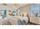 Beautiful bedroom featuring an elegant chandelier and decorative wallpaper at 15627 W Williams St, Goodyear, AZ 85338