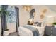 Cozy bedroom featuring modern decor and elegant light fixture at 15627 W Williams St, Goodyear, AZ 85338