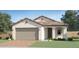 Charming single-story home featuring a neutral color palette, a two-car garage, and a classic tile roof at 15627 W Williams St, Goodyear, AZ 85338
