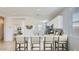 Bright kitchen boasts a large island with seating and modern appliances at 15627 W Williams St, Goodyear, AZ 85338