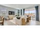 Bright, well-appointed living room features large windows, modern decor, and comfortable seating arrangement at 15627 W Williams St, Goodyear, AZ 85338