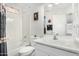 Bright bathroom featuring a shower-tub combo and a white vanity at 16091 W Moreland St, Goodyear, AZ 85338