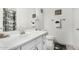 Bright bathroom featuring white cabinets, updated fixtures, and a clean, modern aesthetic at 16091 W Moreland St, Goodyear, AZ 85338