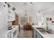 Bright kitchen with adjacent dining area and white appliances at 16091 W Moreland St, Goodyear, AZ 85338