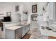 Kitchen boasts ample counter space and unique brick-style flooring at 16091 W Moreland St, Goodyear, AZ 85338