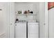 A conveniently located laundry room featuring a washer and dryer at 16091 W Moreland St, Goodyear, AZ 85338