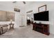 Comfortable living room featuring a TV, and an open doorway at 16091 W Moreland St, Goodyear, AZ 85338