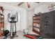 An office space featuring exercise equipment, wall-to-wall carpeting and a Liberty safe at 16091 W Moreland St, Goodyear, AZ 85338
