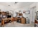 Office space with wooden desks, storage, and natural light, perfect for working from home at 16091 W Moreland St, Goodyear, AZ 85338