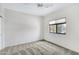 This bedroom offers neutral carpet, a ceiling fan, and a window for natural light at 16450 E Avenue Of The Fountain -- # 20, Fountain Hills, AZ 85268