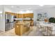 Spacious kitchen features stainless steel appliances, an island, and an adjacent dining area at 16450 E Avenue Of The Fountain -- # 20, Fountain Hills, AZ 85268