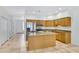 Spacious kitchen with wood cabinets, island, and stainless-steel appliances at 16450 E Avenue Of The Fountain -- # 20, Fountain Hills, AZ 85268