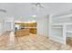 Inviting living area boasts lots of natural light, neutral tile, and an adjacent kitchen at 16450 E Avenue Of The Fountain -- # 20, Fountain Hills, AZ 85268