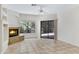 Cozy living area showcases a warm fireplace, tile floors, and a sliding glass door at 16450 E Avenue Of The Fountain -- # 20, Fountain Hills, AZ 85268