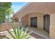Covered patio with tiled flooring, desert landscaping and sliding glass doors at 16450 E Avenue Of The Fountain -- # 20, Fountain Hills, AZ 85268