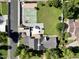 The aerial view shows a tennis court, trampoline, and a meticulously maintained lawn at 1712 E Fairfield St, Mesa, AZ 85203