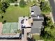 Expansive backyard featuring a sports court, trampoline, patio with seating, and lush greenery at 1712 E Fairfield St, Mesa, AZ 85203