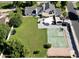 Spacious backyard with green lawn, trampoline, sports court, and an inviting outdoor patio at 1712 E Fairfield St, Mesa, AZ 85203
