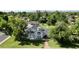 An aerial view showcases the home's expansive backyard and lush landscaping at 1712 E Fairfield St, Mesa, AZ 85203