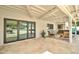 Covered back patio with tile flooring and bi-fold doors leading to the interior at 1712 E Fairfield St, Mesa, AZ 85203