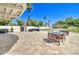 Back yard with a large patio, plenty of seating, and sports court at 1712 E Fairfield St, Mesa, AZ 85203