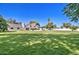 A spacious backyard with a tennis court and well-maintained lawn at 1712 E Fairfield St, Mesa, AZ 85203