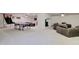 Finished basement with a fireplace, ping pong table, seating area, and neutral carpet at 1712 E Fairfield St, Mesa, AZ 85203