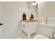 Bathroom with a white vanity, wood countertop, and white tiled walls at 1712 E Fairfield St, Mesa, AZ 85203