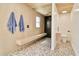 Contemporary bathroom with a built-in bench, rain shower, modern sink, and stylish decor at 1712 E Fairfield St, Mesa, AZ 85203