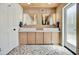 Elegant bathroom features dual sinks, modern cabinetry, and stylish tiled flooring at 1712 E Fairfield St, Mesa, AZ 85203