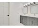 A modern bathroom featuring dual vanities and a tiled floor at 1712 E Fairfield St, Mesa, AZ 85203